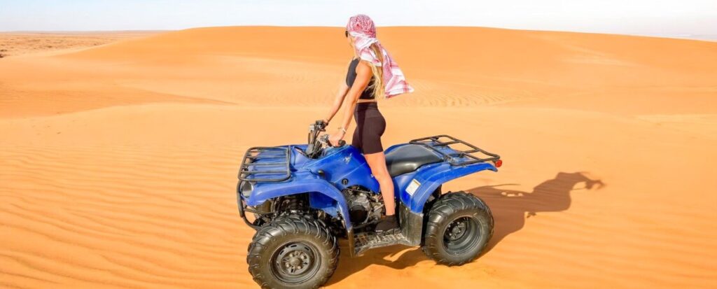 Here are 3 reasons why you need to try the Quad Biking Dubai tour: Unleash Your Inner Adventurer Those who love adventure and thrilling activities will certainly love the quad biking tour. The experience of driving 4-wheel ATV bikes at high speeds of 100 kph on a challenging desert terrain consisting of bumps, rocks, massive dunes, and soft sands is truly unmatched. Also, if you add the beautiful scenery of the surrounding areas, the tour becomes even more memorable. Expert Guidance Available The quad bike tours in Dubai are done under expert guidance so there is no need to worry if you are a beginner and don’t know much about desert driving. The tour guides can teach you the basics of quad biking and explain how to drive them in desert conditions and when to apply brakes, change gears, and accelerate according to the terrain. Also, these guides take care of all the safety arrangements and ensure the visitors have a safe and sound journey. Listen to their instructions and ask any questions without hesitation if you face problems. . Suitable for All Skill Levels Quad biking tours are suitable for all skill levels, as mentioned already. The controls of quad bikes are almost the same as a regular bike and everyone can learn them in little to no time at all. For beginners, the tour starts with a safety briefing and practice sessions before going out into the desert for off-roading. During the practice, make sure to understand how to drive and, on a first tour, choose an easy route instead of a challenging one. Choose shorter tour packages as well instead of lengthy ones. To decide whether quad biking is a suitable activity for you and your group, check out the Pros and Cons of Quad Bike Rental Dubai.